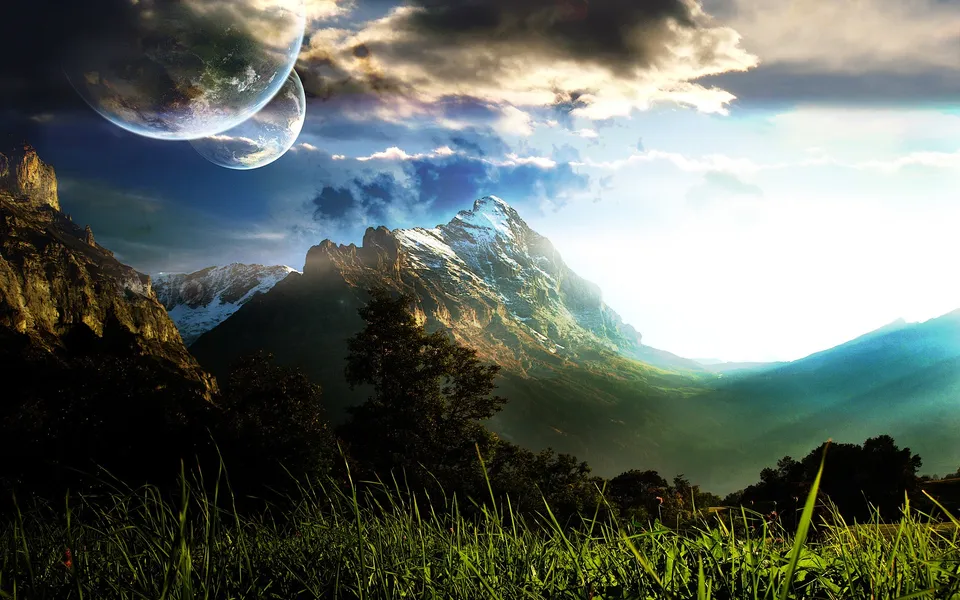 A surreal landscape with two large moons in the sky above snow-capped mountains and a foreground of green grass.