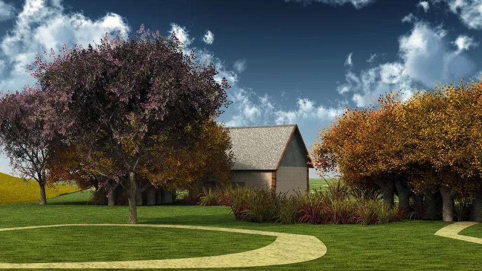 A small house sits nestled among trees displaying vibrant autumn colors under a cloudy blue sky.