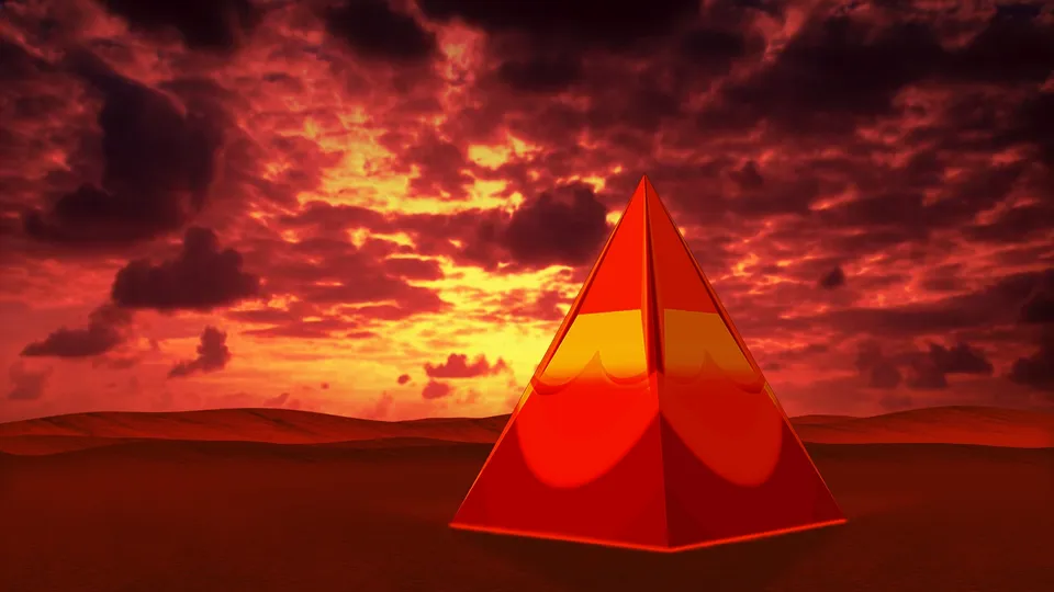 A glowing red pyramid stands in a desert landscape under a dramatic red and yellow sky.