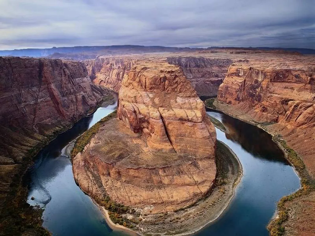 Horseshoe Bend canyon with dramatic desert cliffs and river.