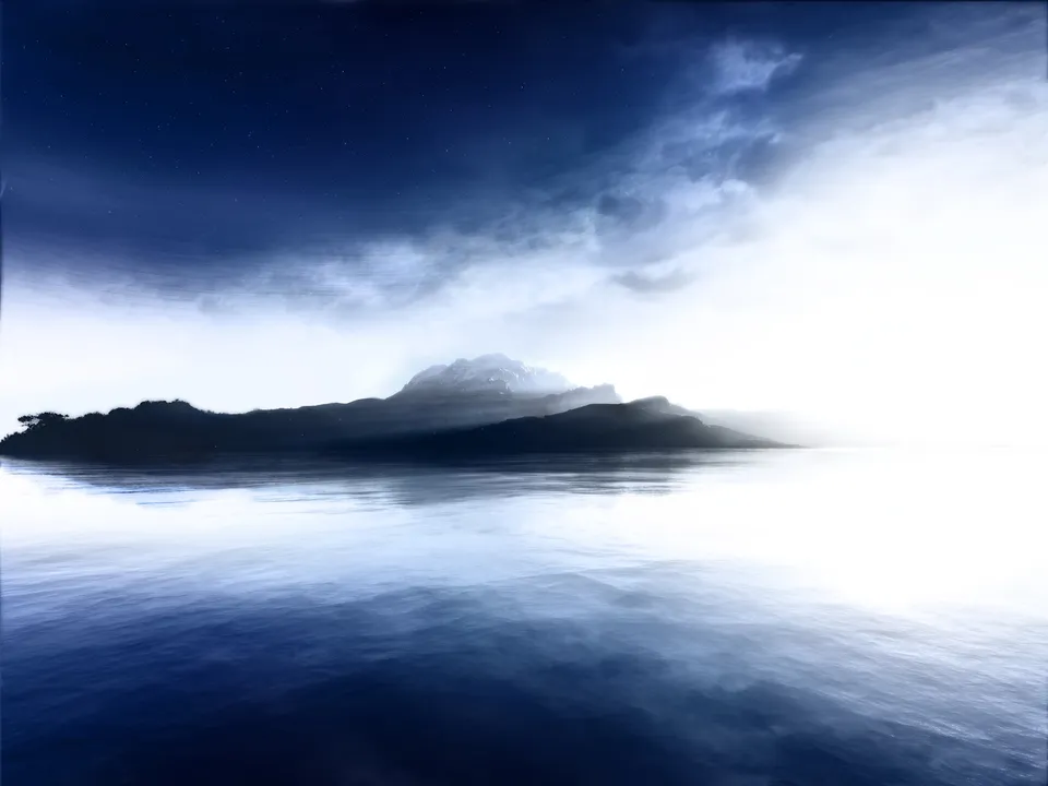 A dark silhouette of a misty mountain island is reflected in the calm, dark blue water under a starry, cloudy sky.