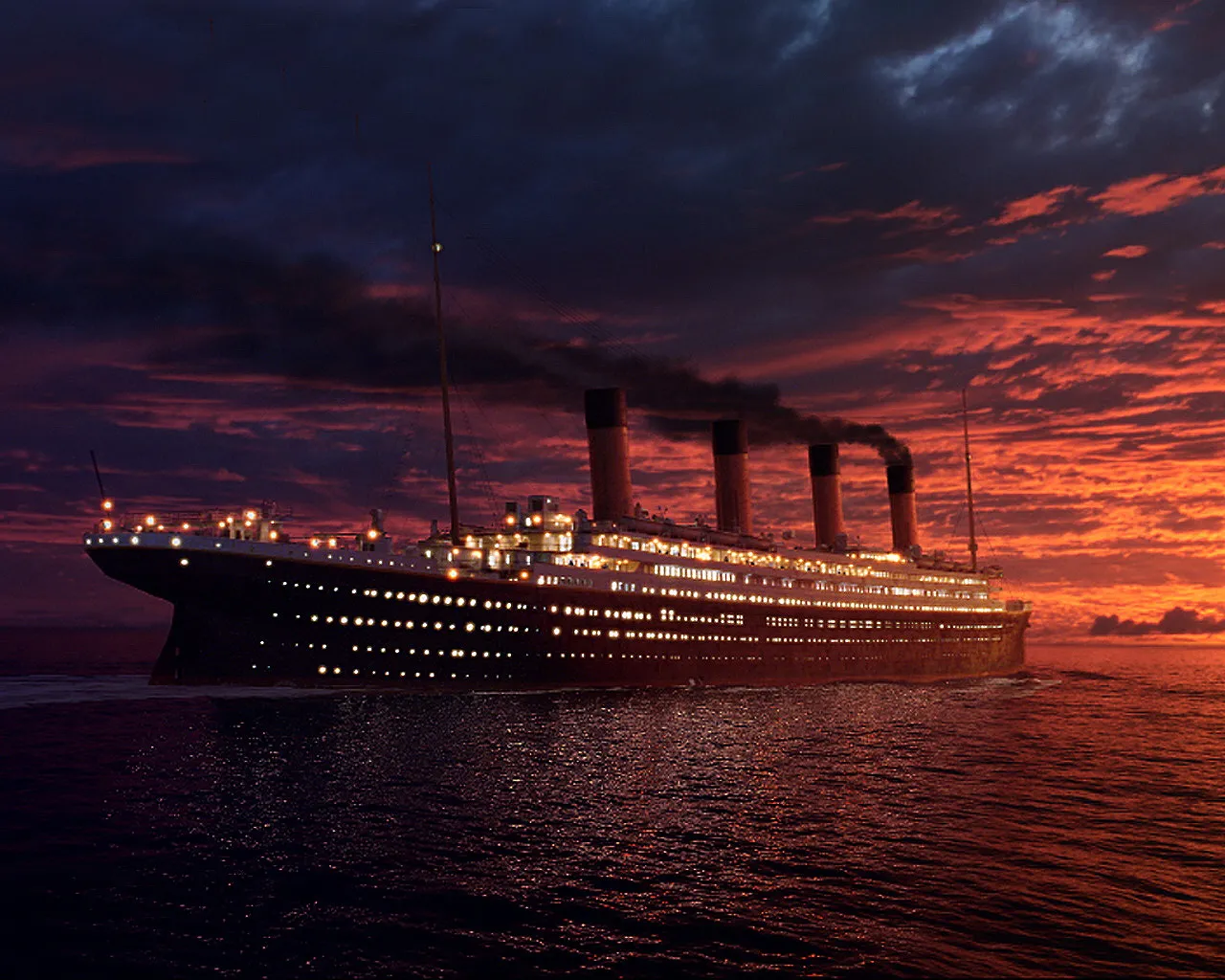 A large ocean liner with many lit windows sails on the sea under a dramatic sunset sky with red and dark clouds.