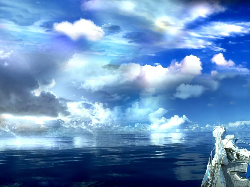 A sailboat sails on a deep blue ocean under a dramatic sky filled with white and gray clouds.