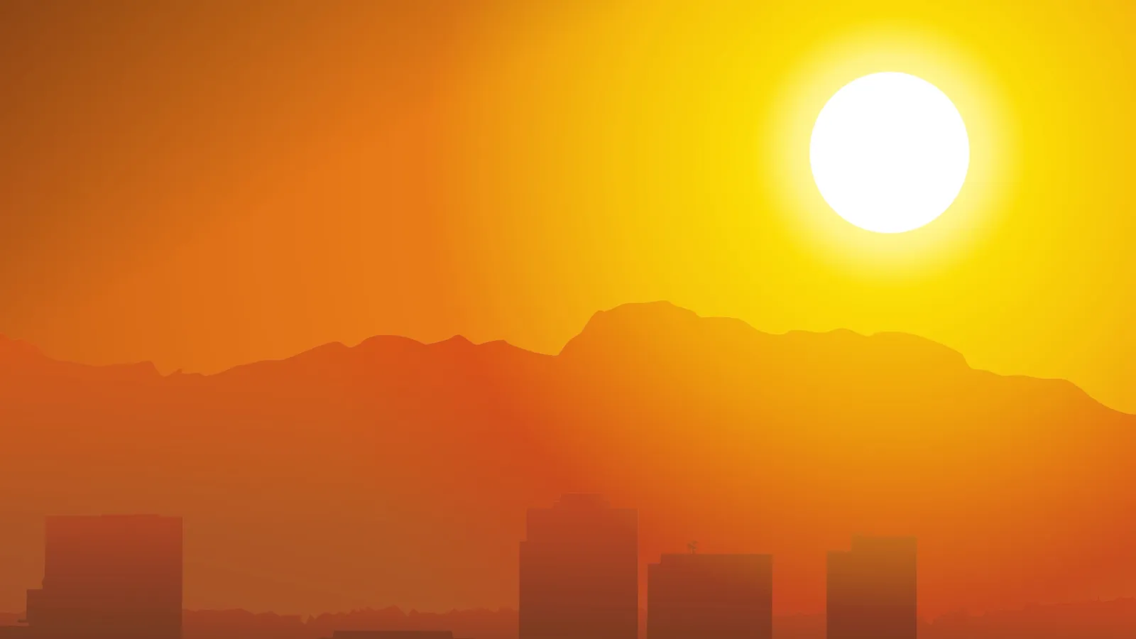 A bright sun sets behind hazy mountains, casting an orange glow over a silhouetted cityscape.